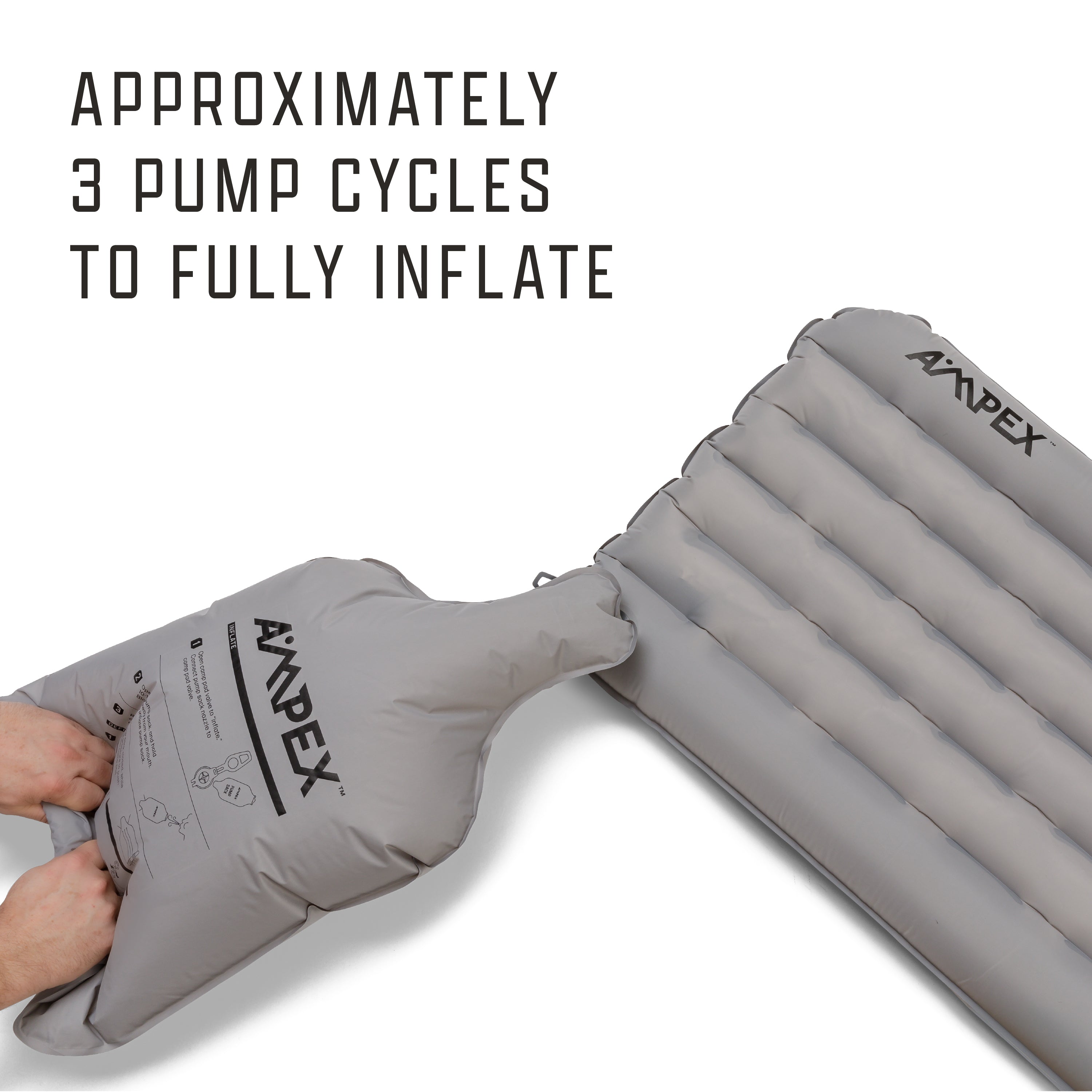 Sleeping pad with Ampex logo being inflated with a gray pump sack.
