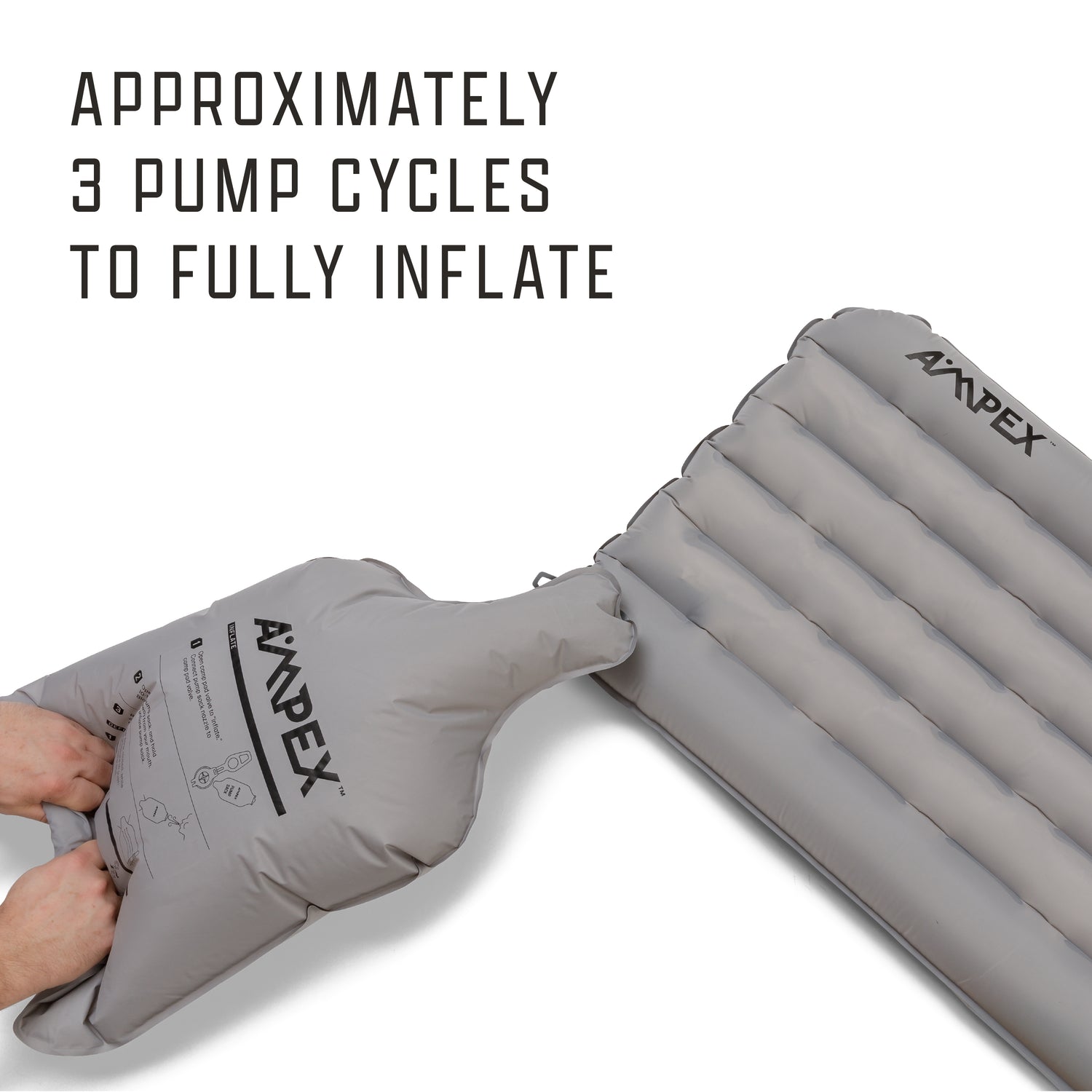 Sleeping pad with Ampex logo being inflated with a gray pump sack.