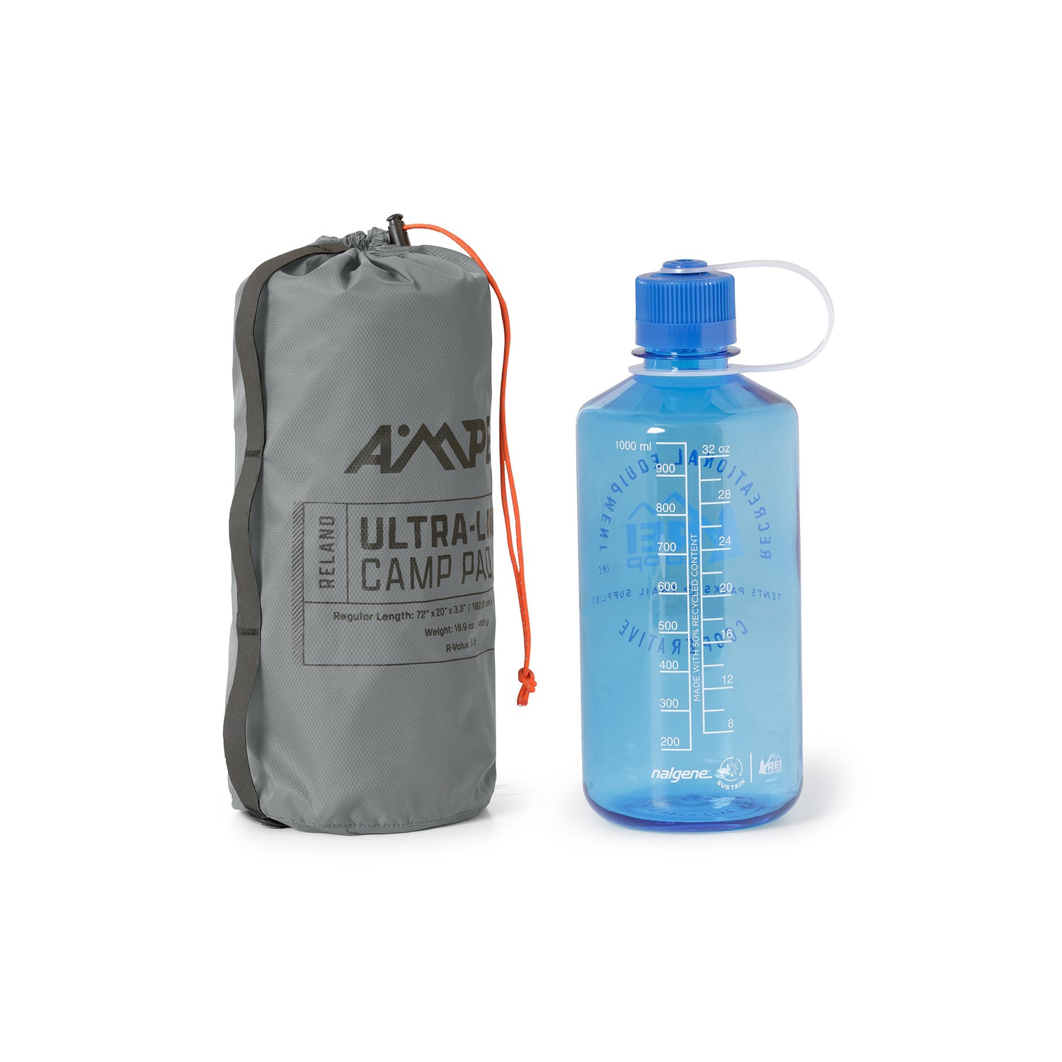 Ampex sleeping pad rolled and packed into a tall gray storage sack, shown next to a blue water bottle for size comparison.