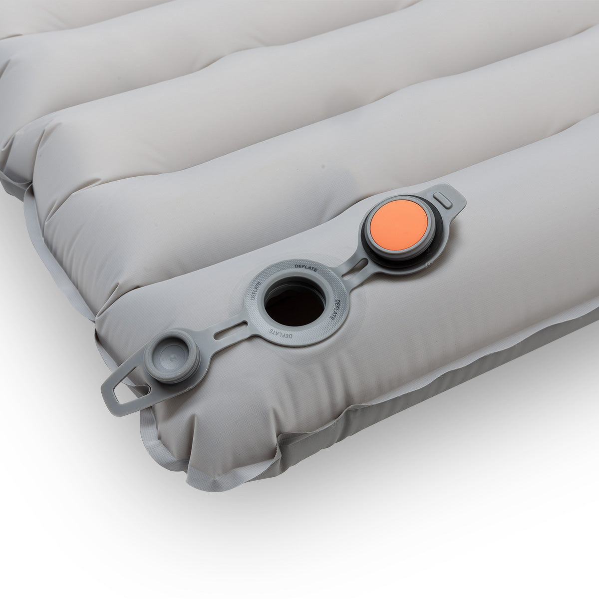Close-up of valve partially open, showing the orange interior inflation mechanism.