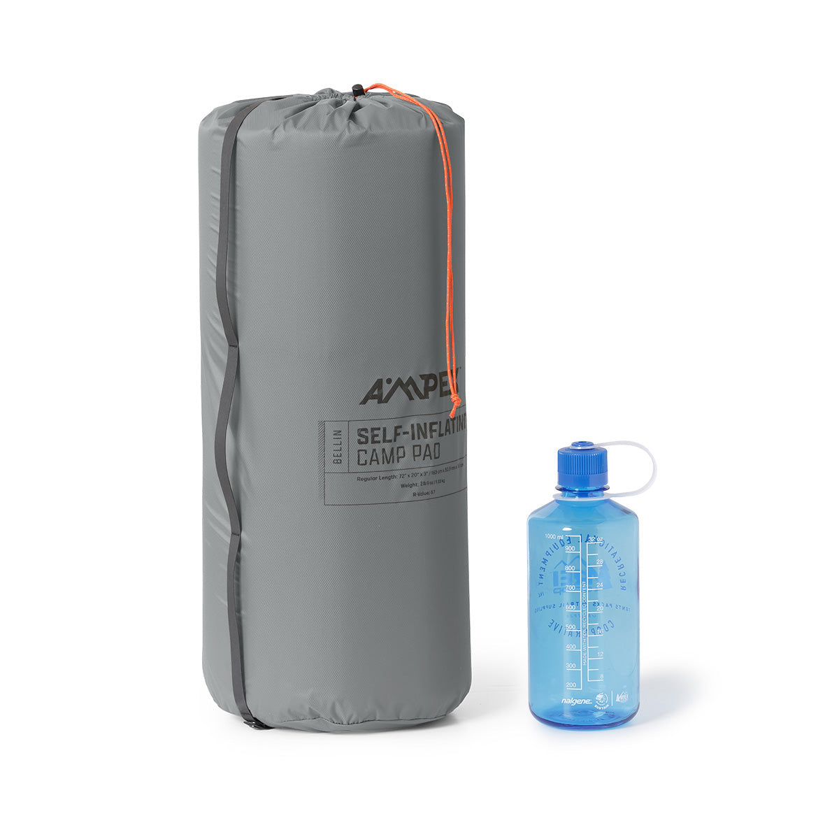 Ampex sleeping pad rolled and packed into a tall gray storage sack, shown next to a blue water bottle for size comparison.