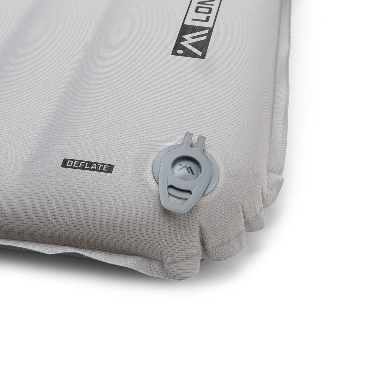 Close-up of the gray Ampex sleeping pad with the deflation valve in the closed position.