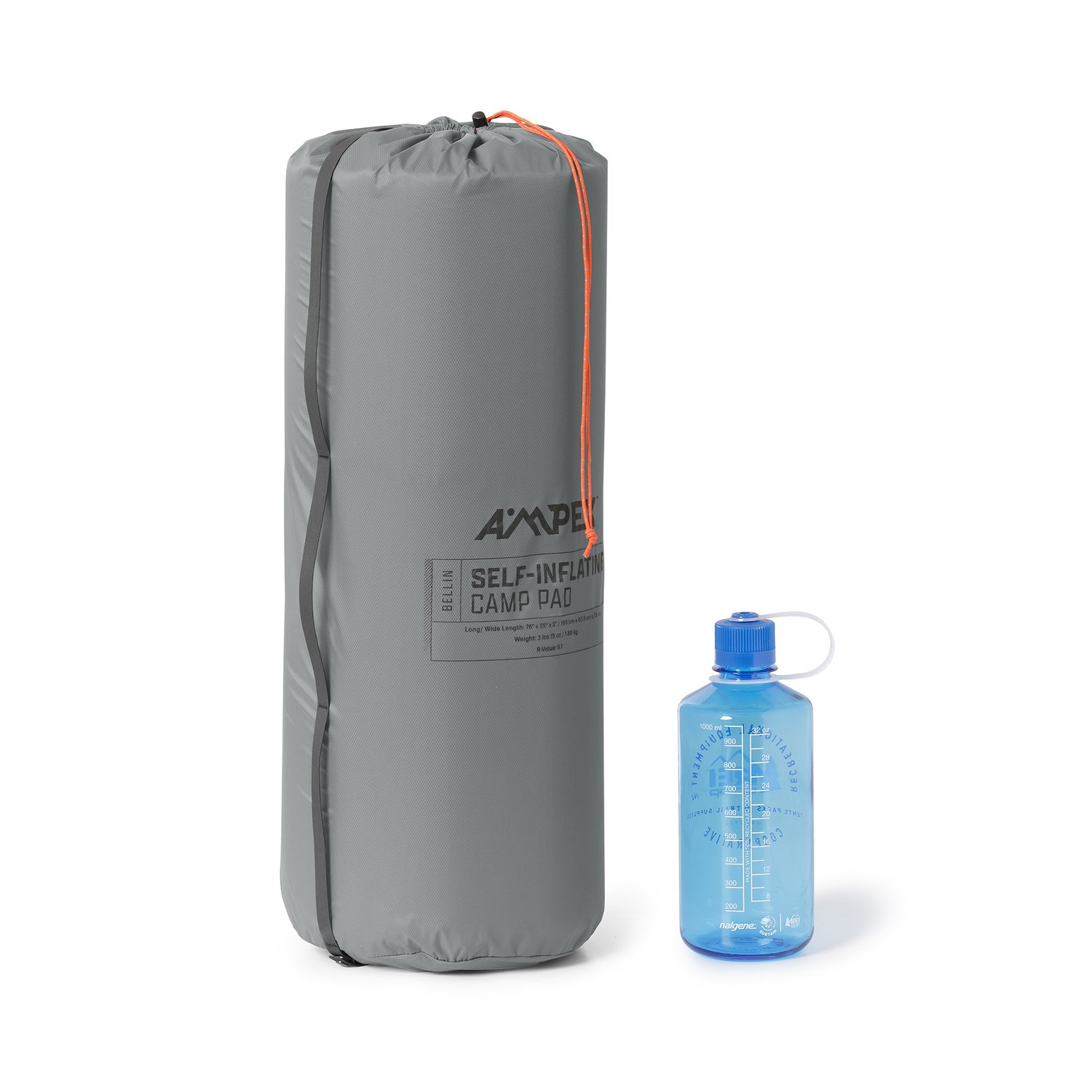 Ampex sleeping pad rolled and packed into a tall gray storage sack, shown next to a blue water bottle for size comparison.
