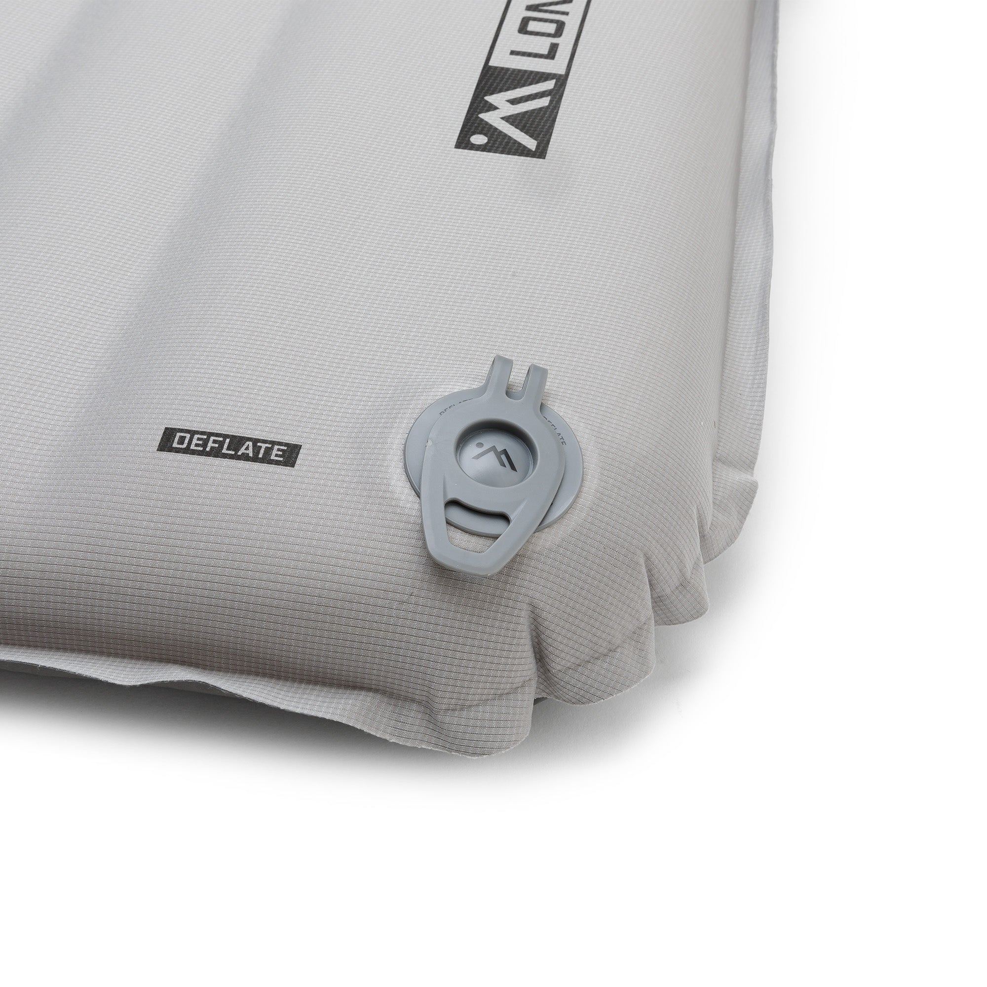 Close-up of the gray Ampex sleeping pad with the deflation valve in the closed position.