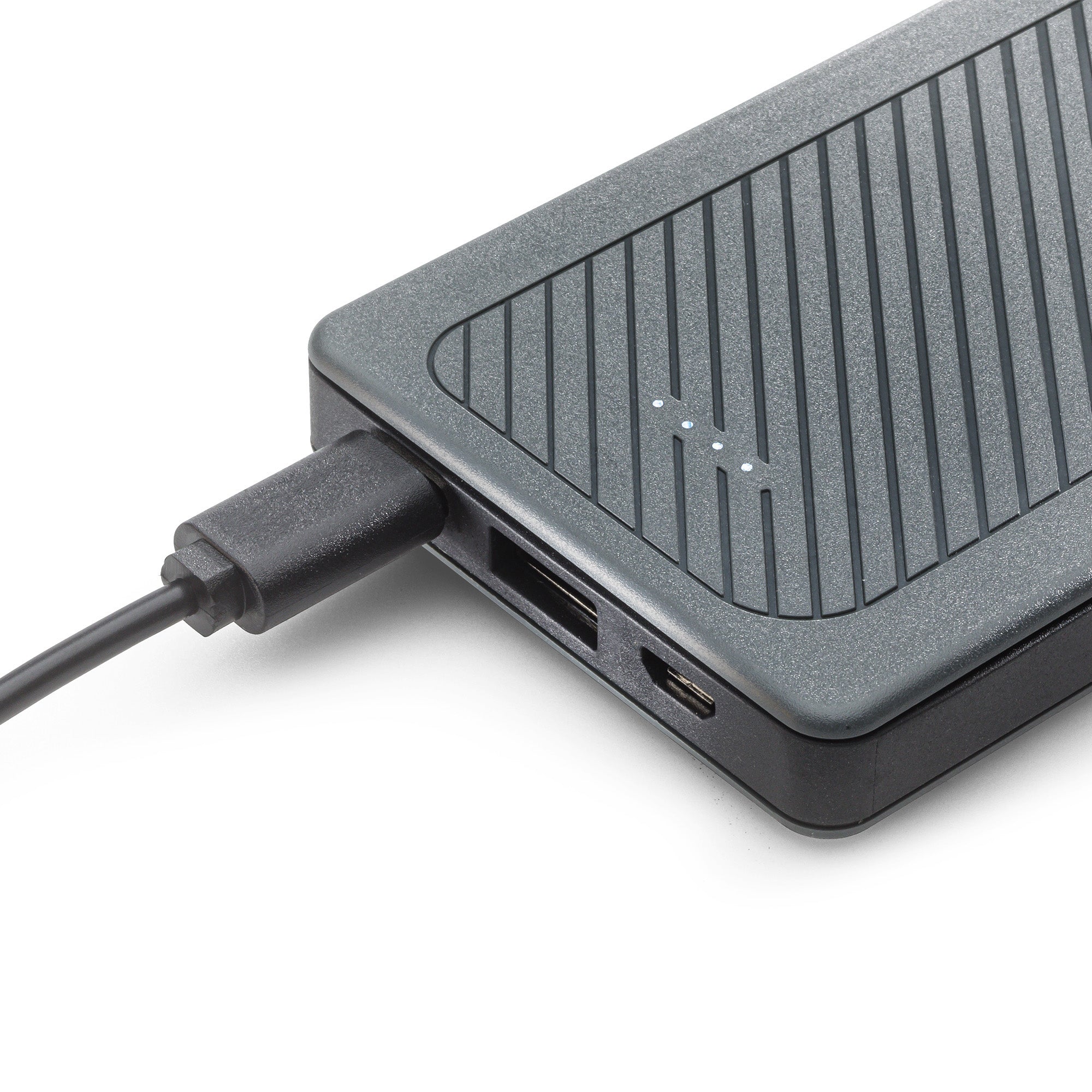 A close-up of the power bank being charged using a Micro USB-C cable.
