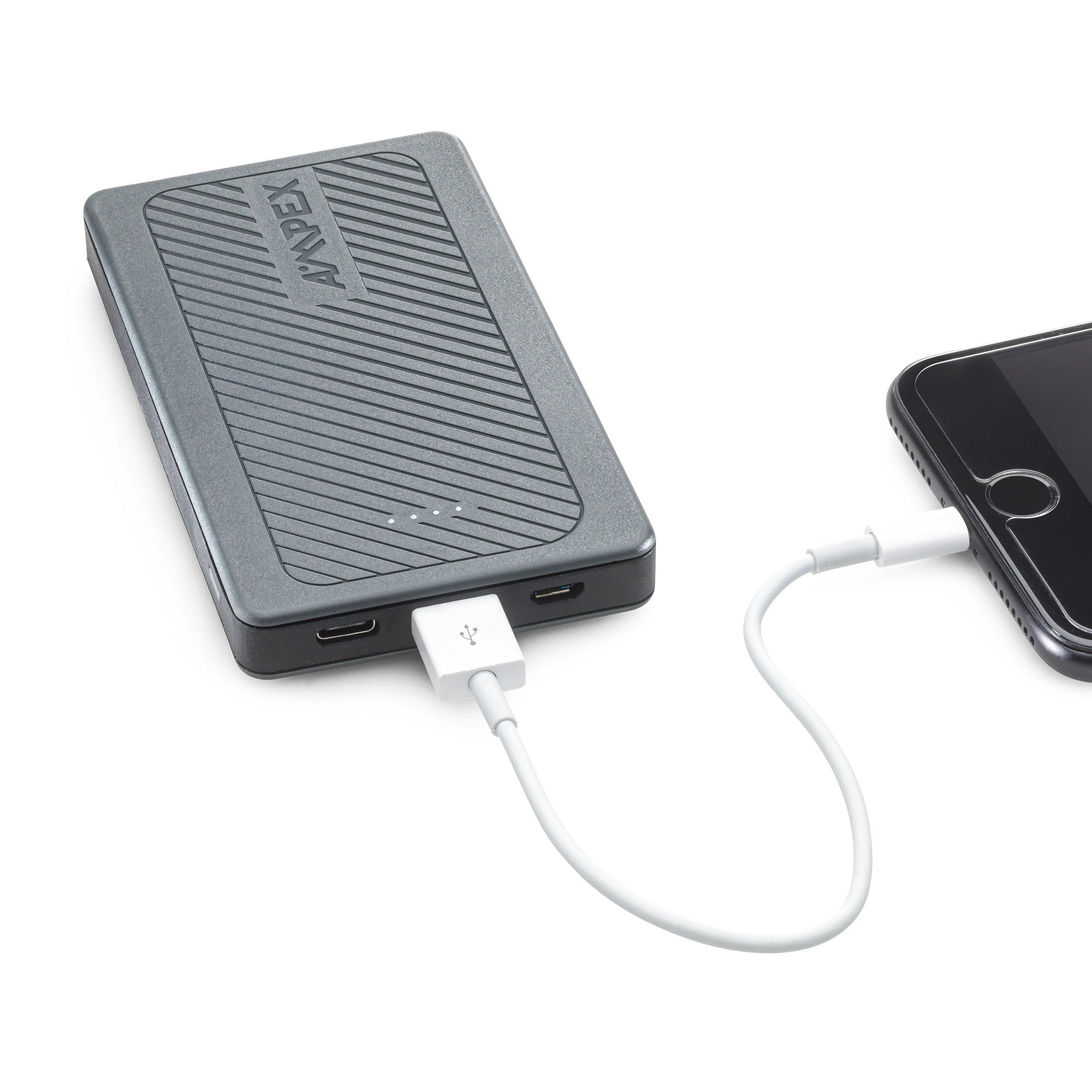The power bank connected to an Iphone using a USB/lightning cable.