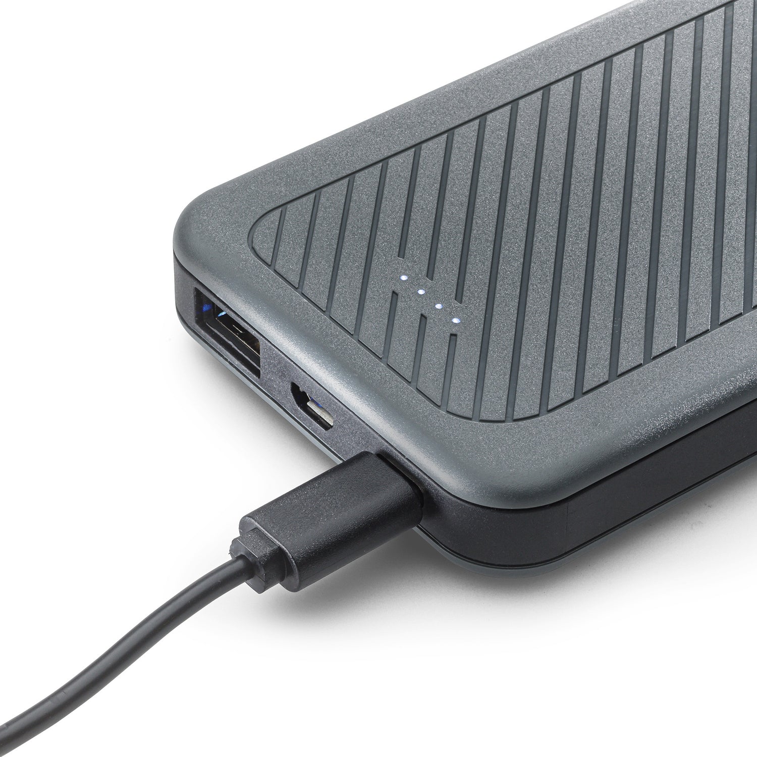 Close-up of 10,000mAh Power Bank charging a device with a USB cable.