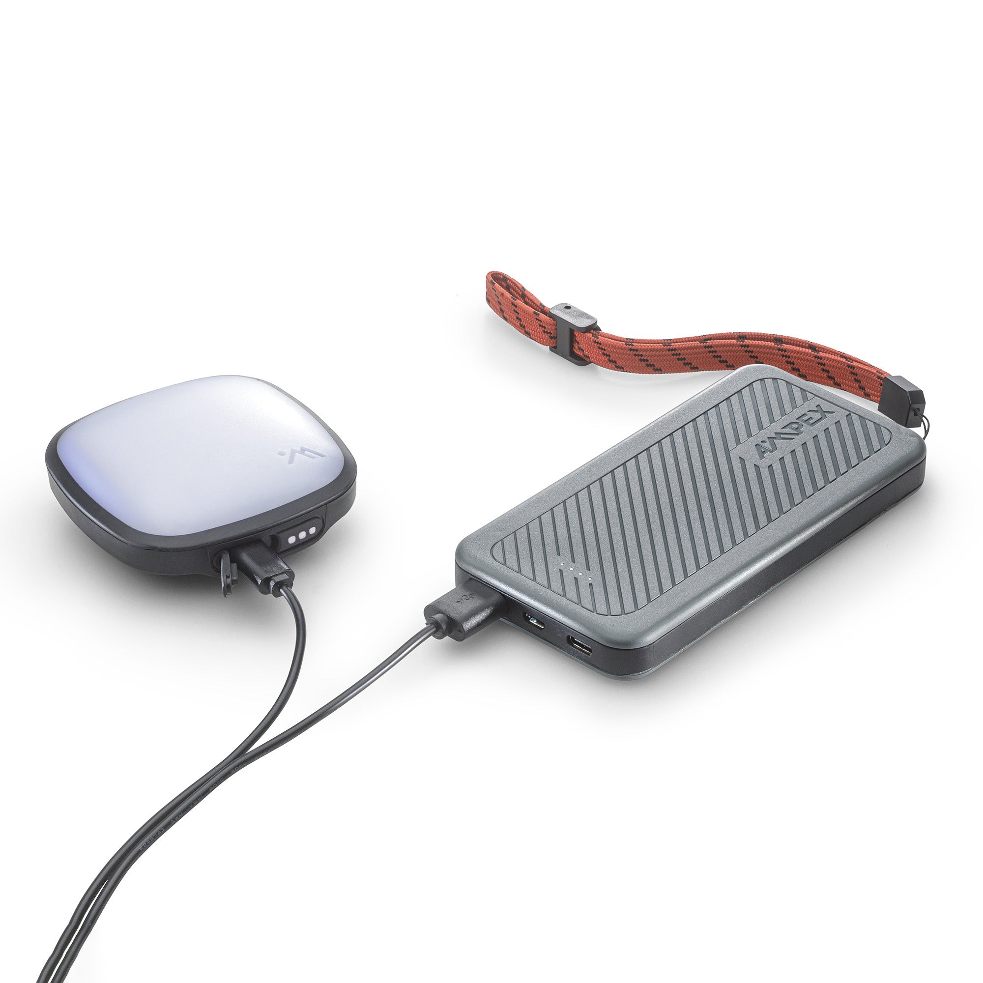 Power Bank with USB-C cable charging a light.