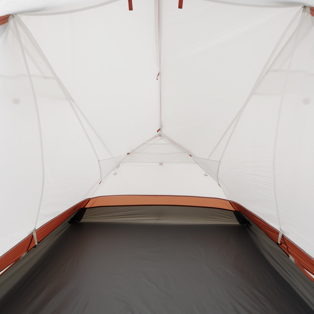 Inside view of the tent showing spacious floor area and mesh canopy with red trim.