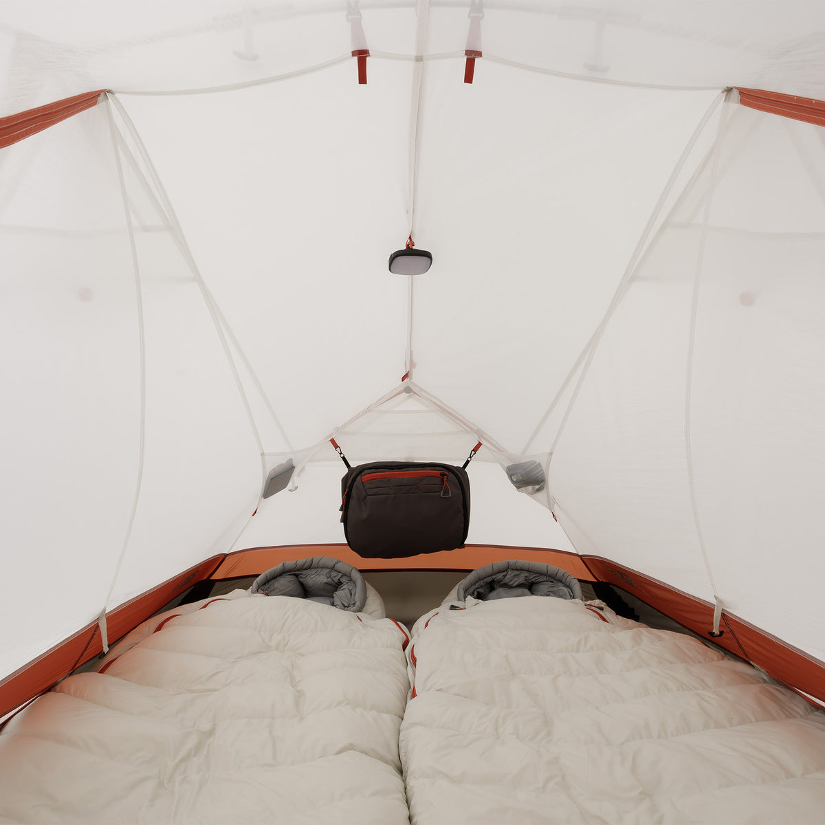 Two sleeping bags laid side by side inside the tent, showing spacious floor area.