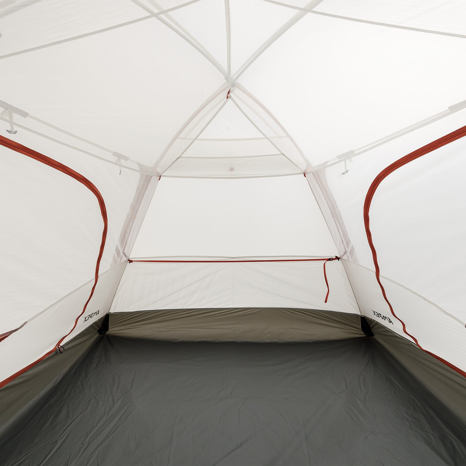Inside view of the tent showing spacious floor area and mesh canopy with red trim.