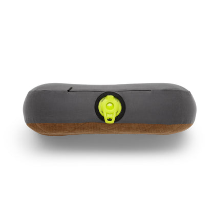 Green valve on side of pillow on white background